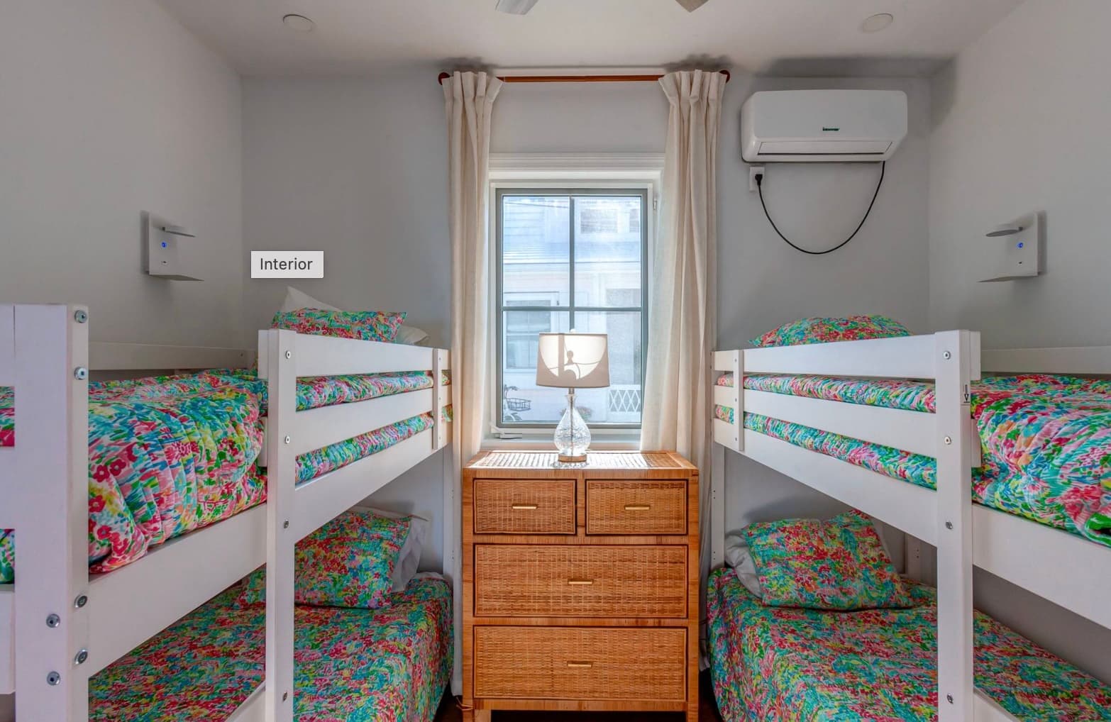 Bunk room with colorful tropical bedding