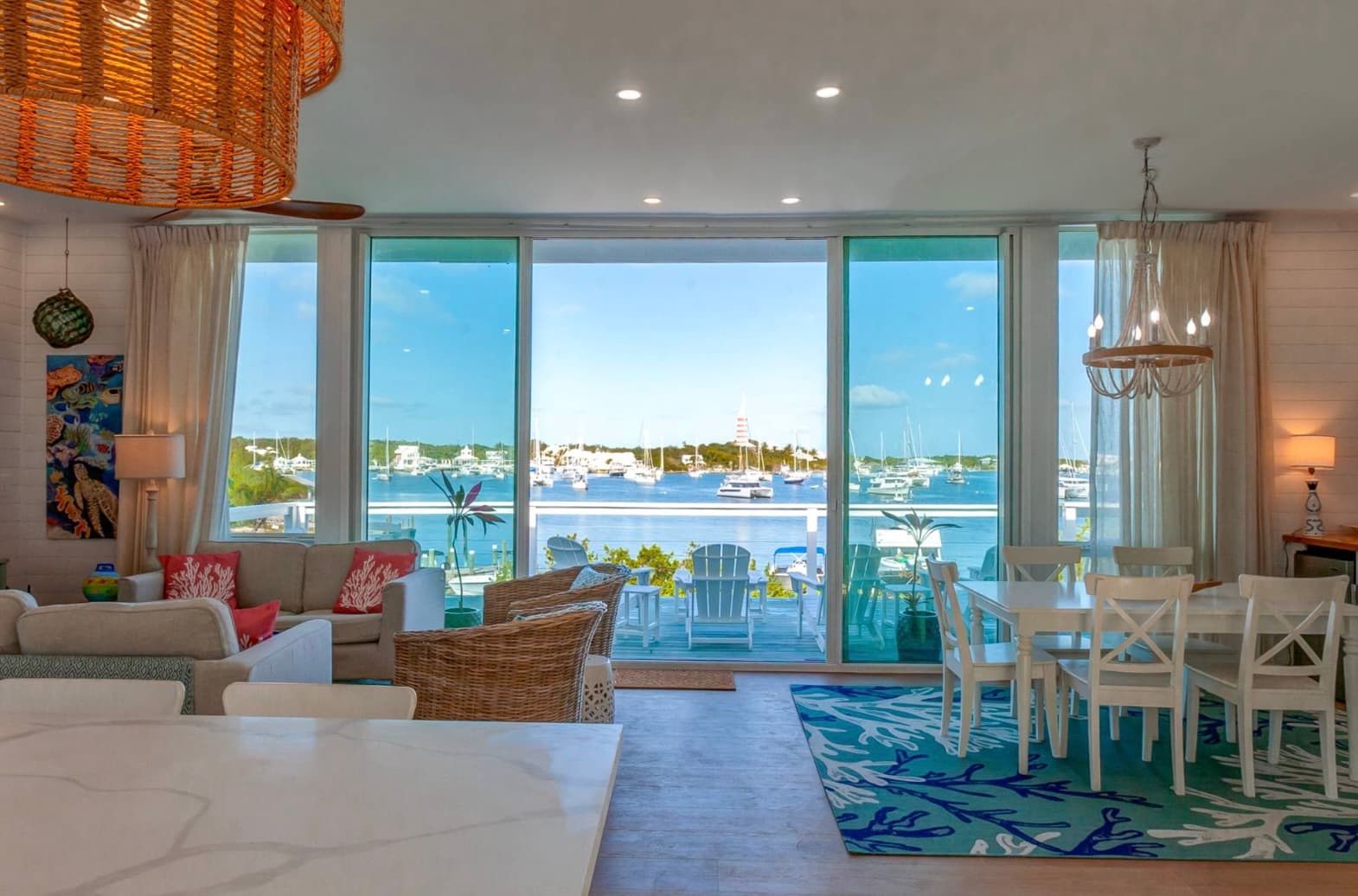 Open plan living with full wall of windows overlooking harbour