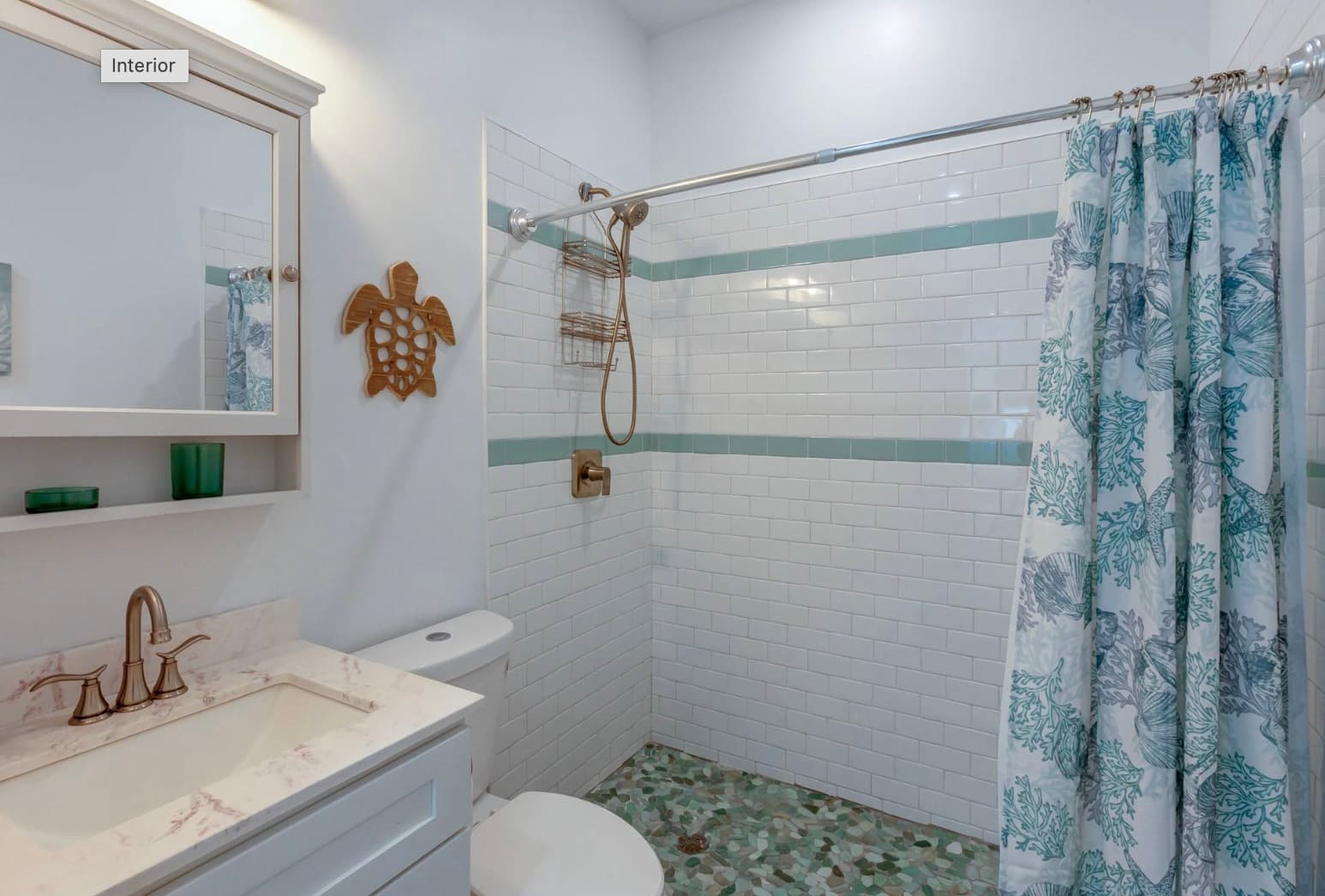 Guest bathroom with subway tile and decorative accents