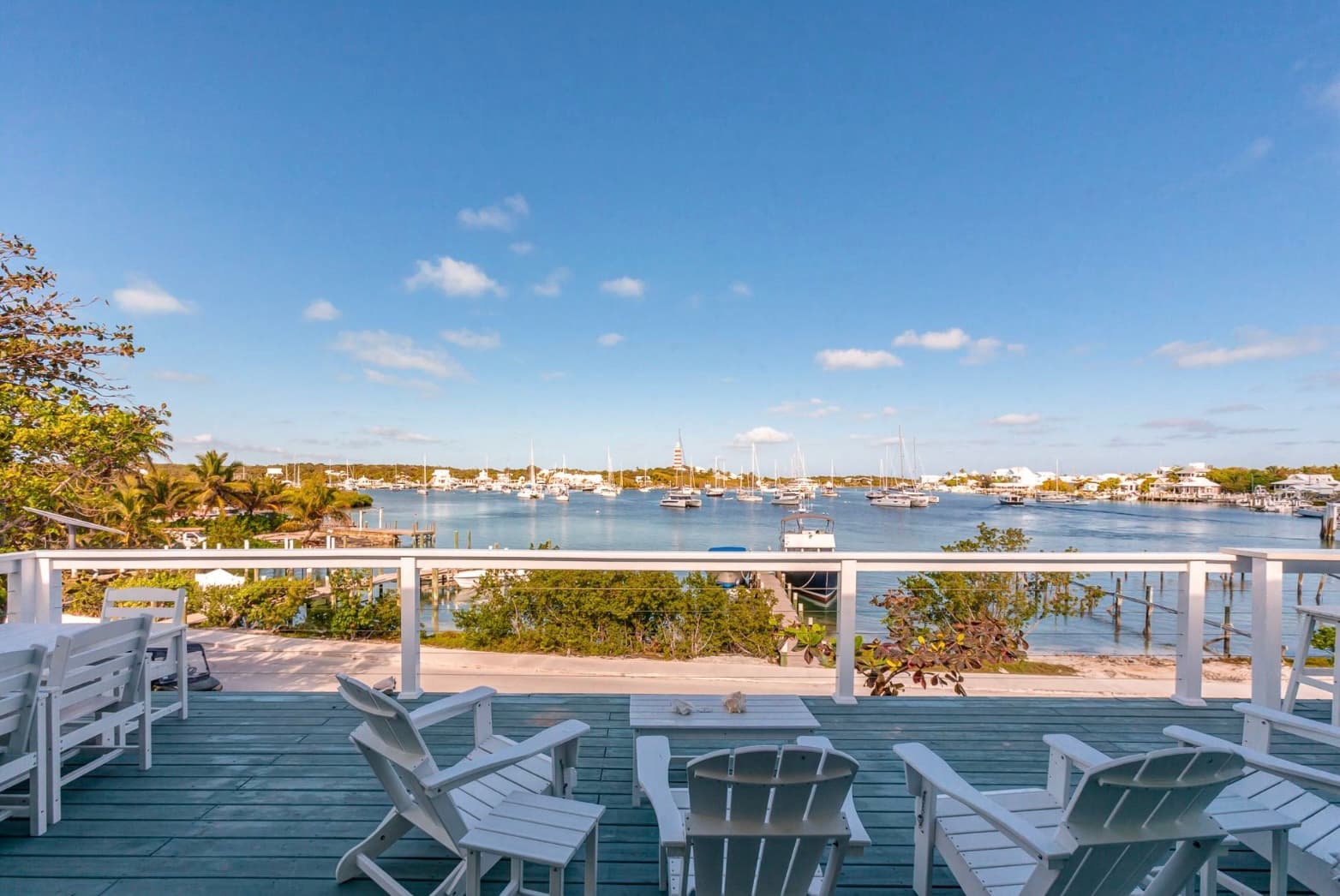 Deck with Adirondack chairs overlooking the harbour
